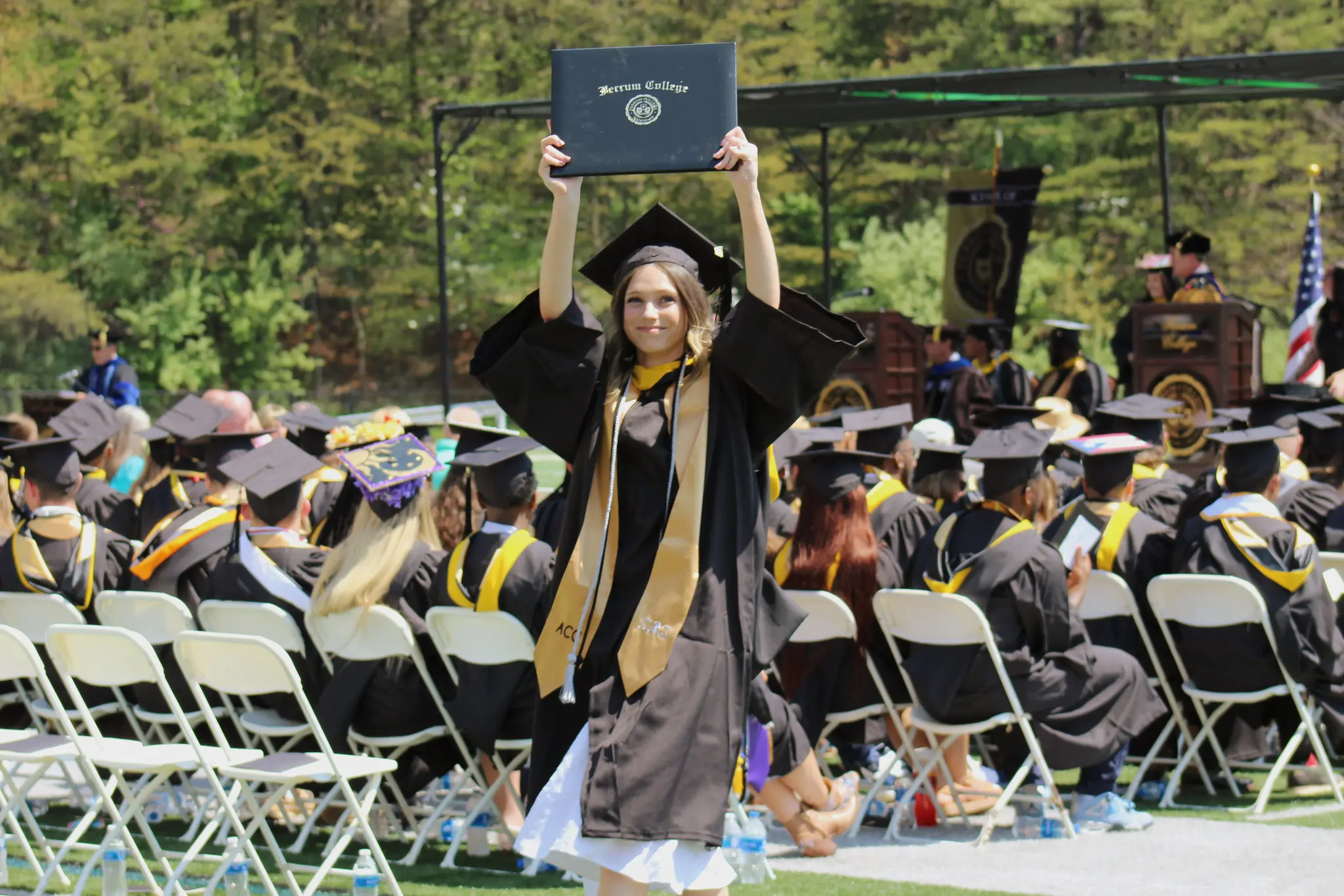 woman holding diploma