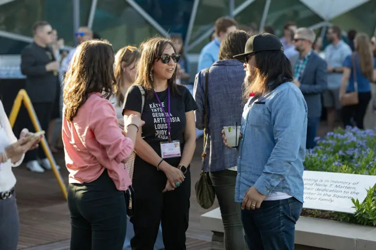 People gathered outside at a social event during a conference