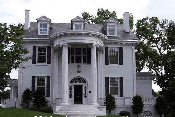 Stately, large, white colonial homes with a portico and columns.