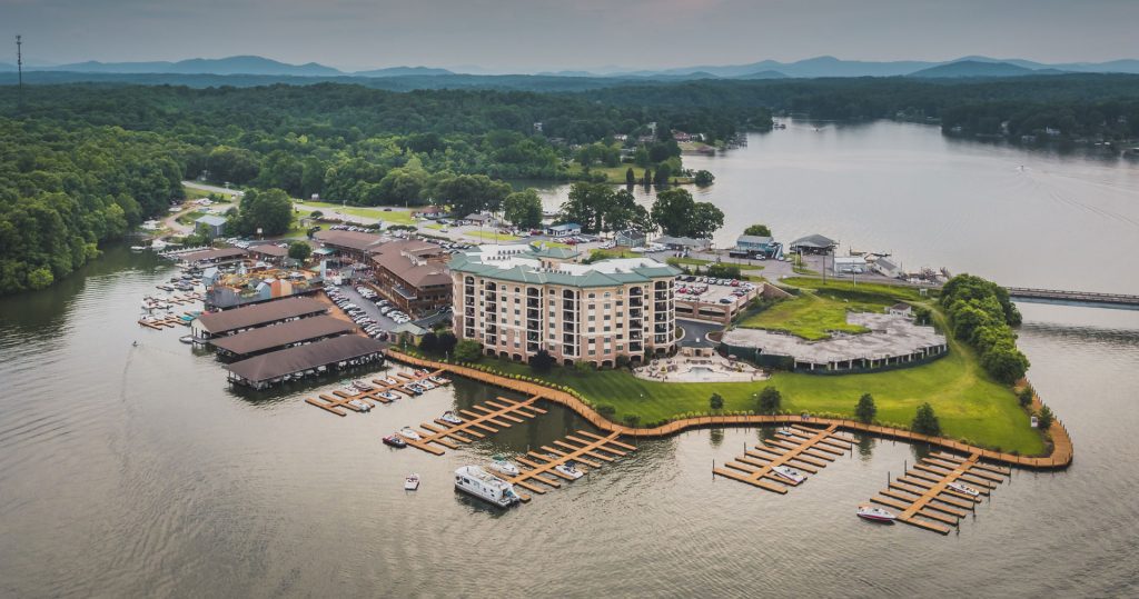 Aerial drone shot of a large condo building and a marina at Smith Mountain Lake in Franklin County, VA.