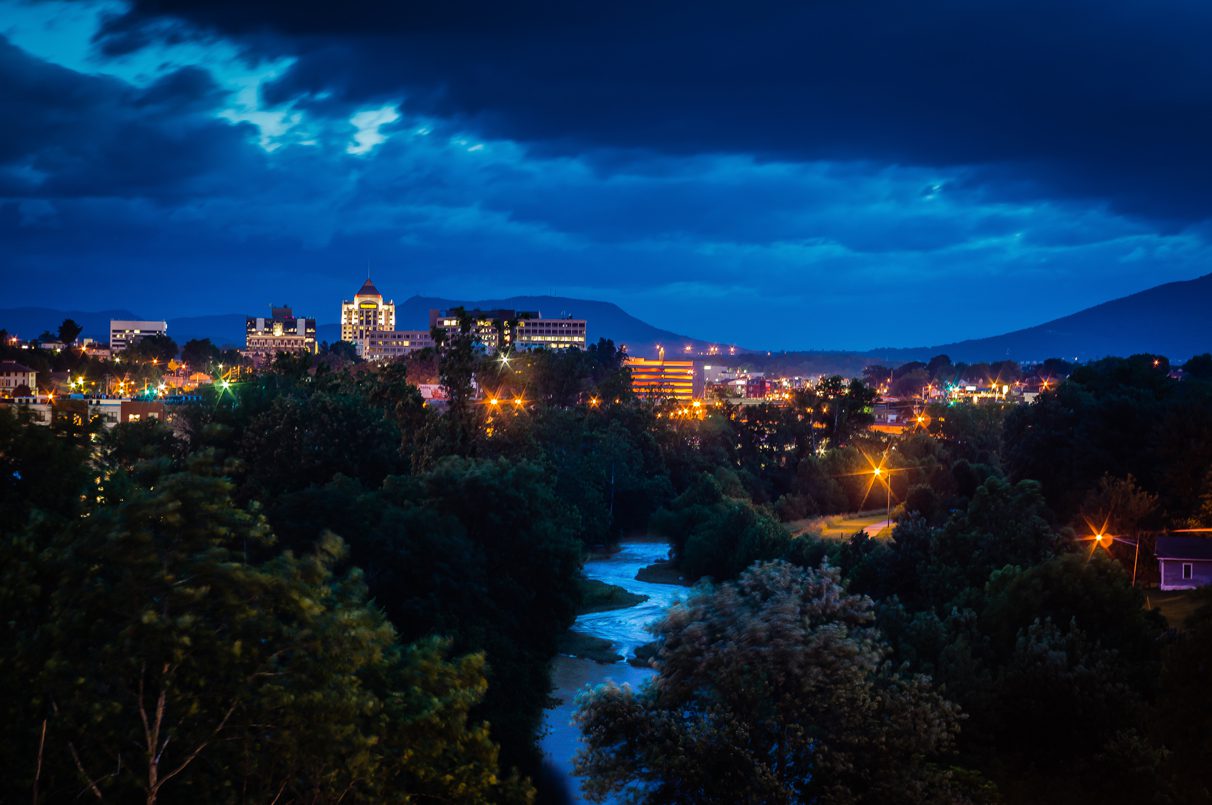 night time view of river and downtown roanoke