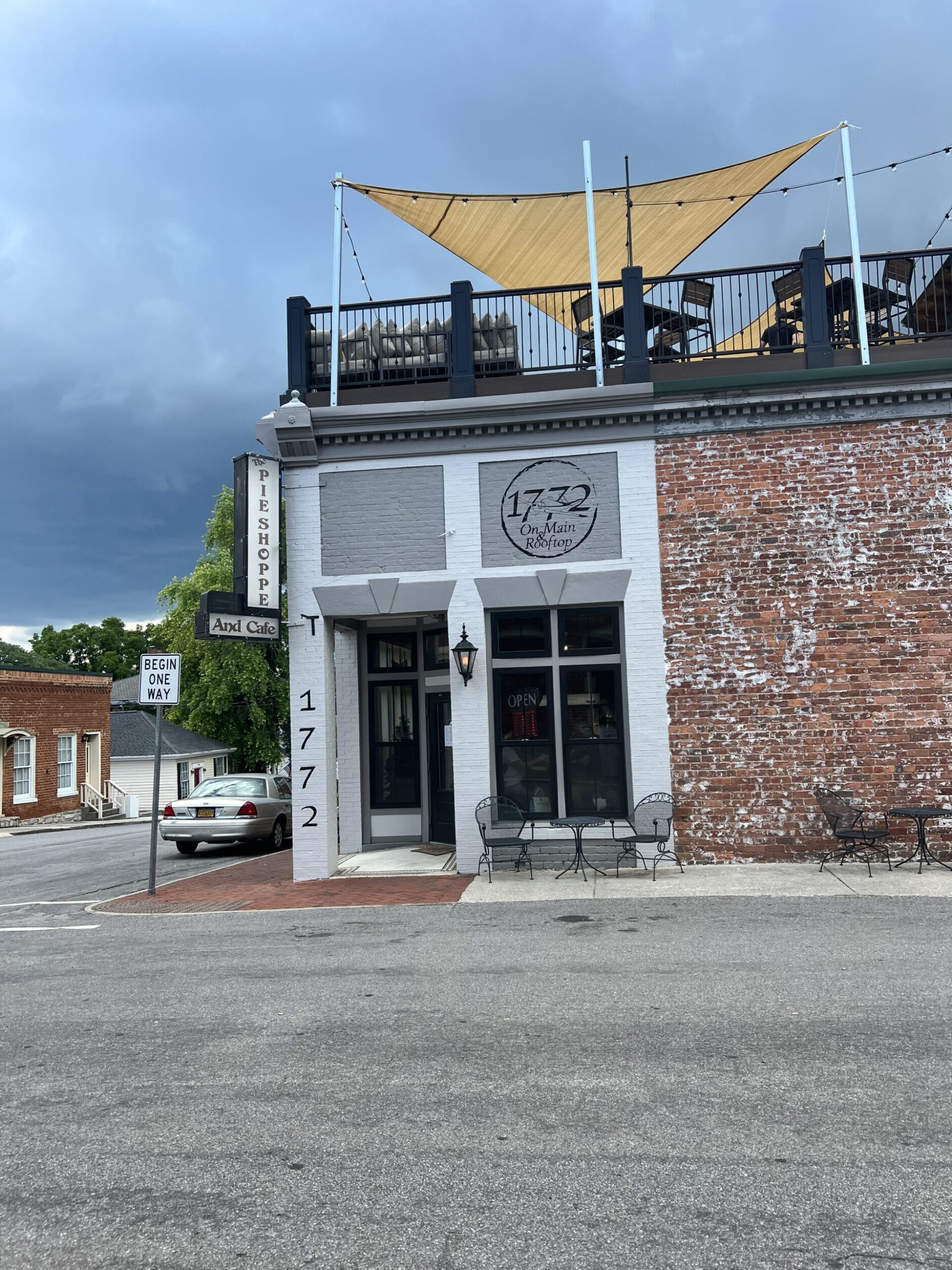 Exterior shot of the 1772 Rooftop Bar and Restaurant in Fincastle, VA. It's a partly cloudy, summer day.