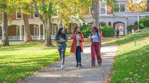 three students on hollins university campus