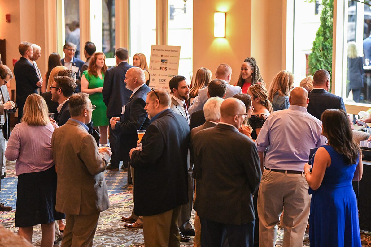 large group of people networking in a hall
