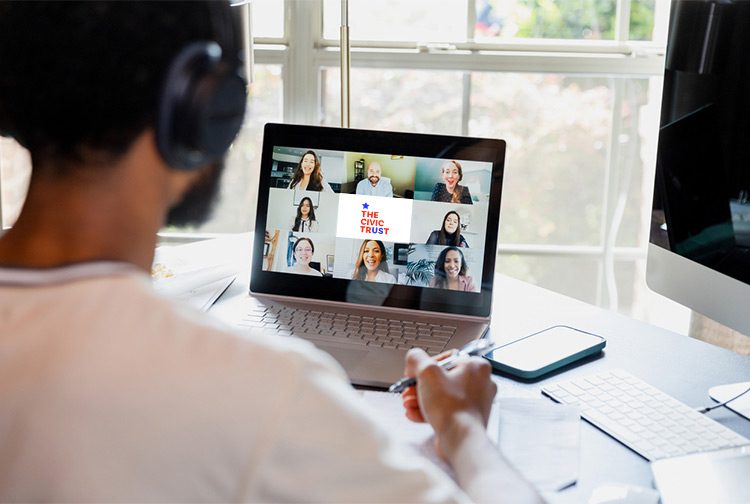 A person taking notes while in a virtual training session with others