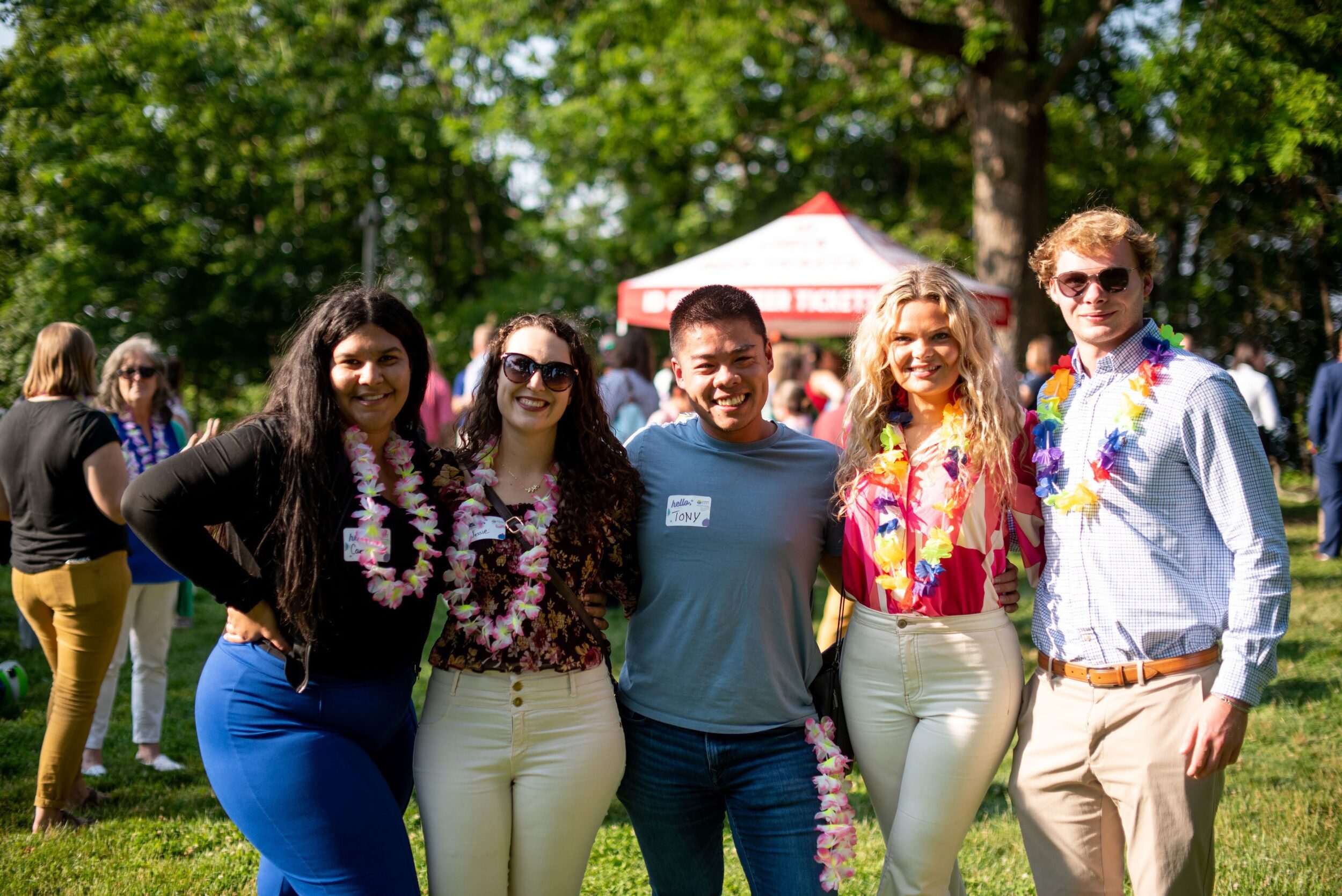 Five young professionals pose at a Get2KnowNoke quarterly social hosted on Mill Mountain in the City of Roanoke, VA.
